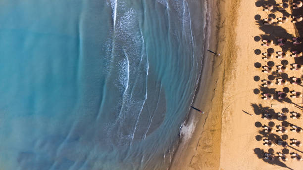 istock Aerial view of sandy beach and waves 1332811079
