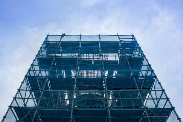 istock Scaffolding and safety nets and blue sky background. 1332812246