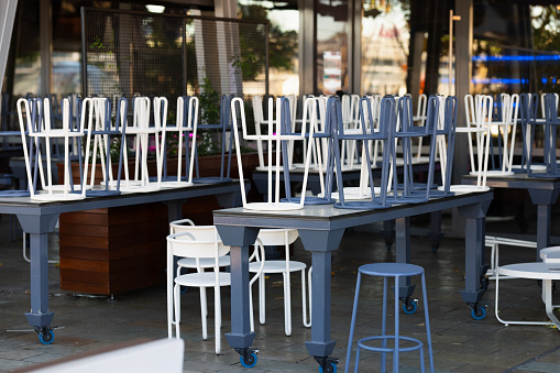 Chairs upside-down on tables.