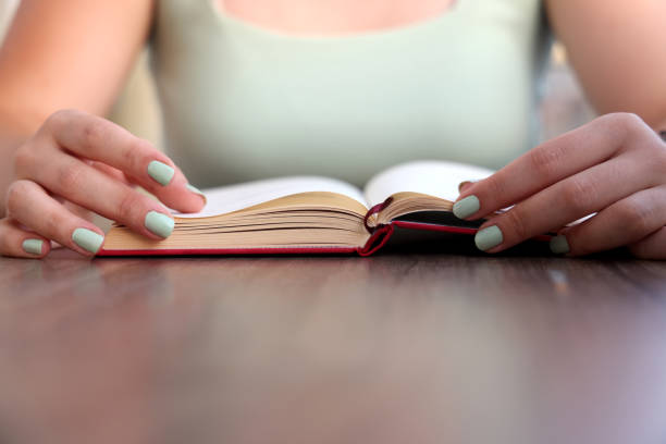 istock Young women reading a book 1332814757