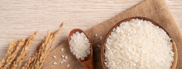 istock White rice in a bowl on wooden table background. 1332817200