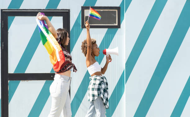 women gay pride flag megaphone - parade rest imagens e fotografias de stock