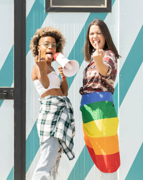 istock two multiracial women at gay pride demonstration 1332828472