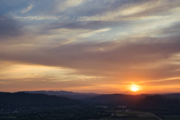 Vidauban, France - July 25, 2021. Panoramic view of a majestic sunset over the mountains of Provence and the region of Saint-Tropez.