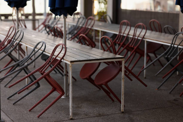 Chairs upside-down on tables.
