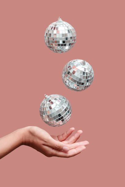 istock disco ball floating in the air under hand 1332833840