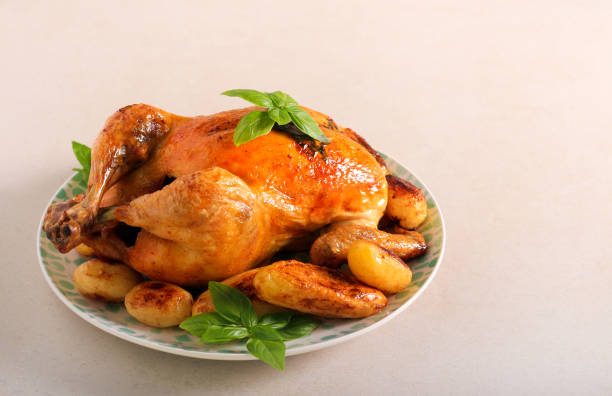 istock Roast herby chicken with potatoes 1332834714