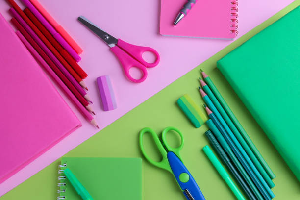 istock Many multi-colored school supplies are selected in a color scheme on bright multi-colored backgrounds 1332835579