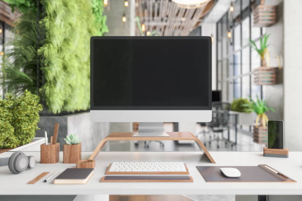 istock Office Desk Setup In Sustainable Green Co-working Office Space 1332835659