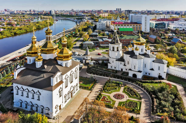 Aerial view on Holy Trinity Monastery. Tyumen Tyumen, Russia - September 17, 2015: Aerial view on Holy Trinity Monastery. Church of Saints Peter and Paul and Holy Trinity Cathedral. Historical center of city monastery religion spirituality river stock pictures, royalty-free photos & images