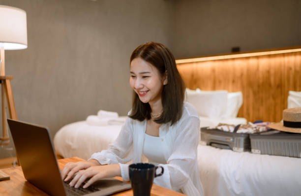 istock Young Woman Working With Laptop in bedroom 1332836744