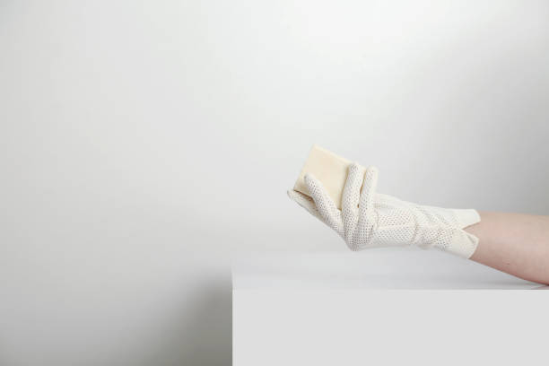 istock olive oil soap held by gloved woman 1332837684