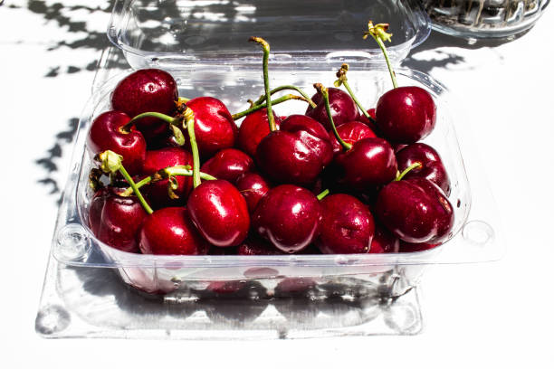 istock Sweet tasty cherries in a plactic container 1332837916