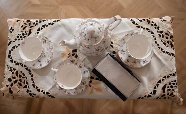 istock Old porcelain on the table. Tea-set. Handmade crockery. 1332839000