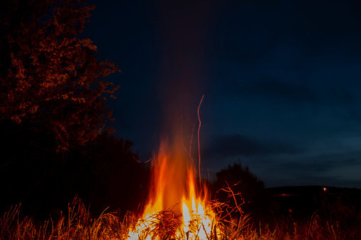 Fire in the garden at blue hour