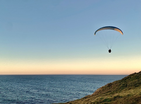 Hong Kong - November 19, 2023 - Paragliding is the recreational and competitive adventure sport of flying paragliders: lightweight, free-flying, foot-launched glider aircraft with no rigid primary structure