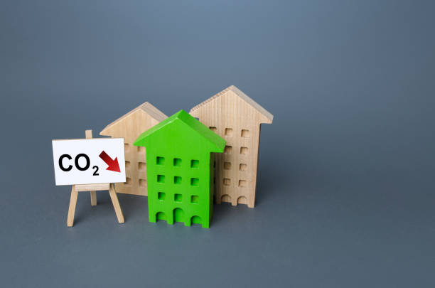 istock Green house and easel with carbon dioxide reduction. Environmentally friendly. Improving utilities and energy efficiency. Reduced greenhouse gas emissions, low carbon footprint. Impact on environment 1332853677
