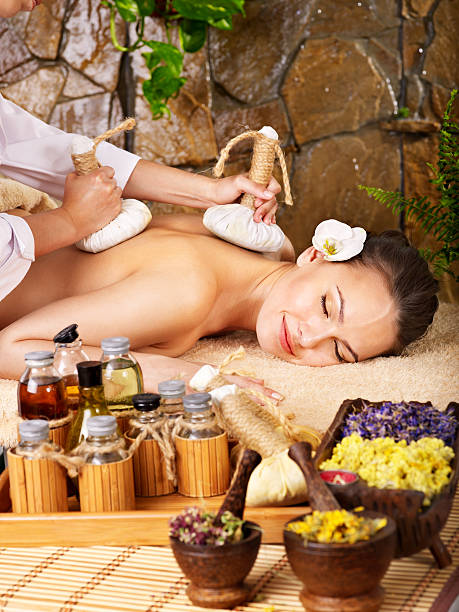 istock Woman getting thai herbal compress massage . 133286142