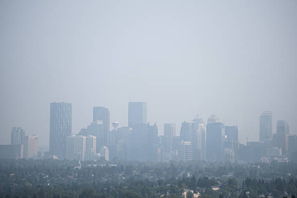 Downtown Calgary Alberta City Skyline under smokeDowntown city street covered with smoke from forest fires