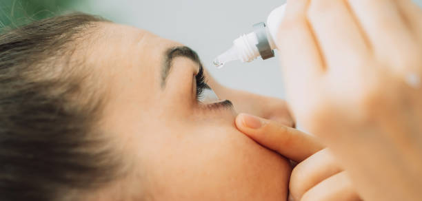 istock Young girl buries her eyes with special eye drops 1332864964