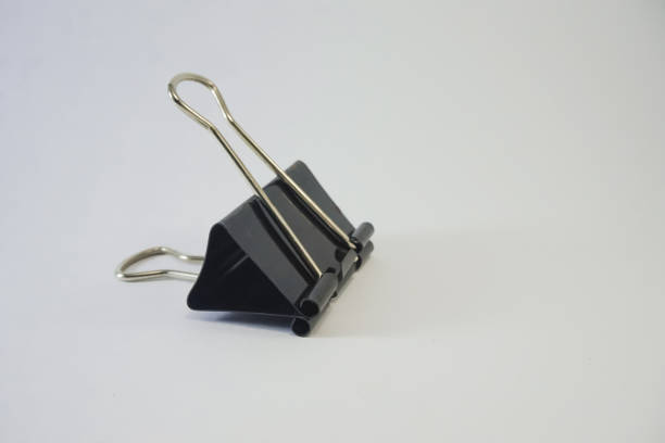 istock Binder clip is black on an white background 1332867367