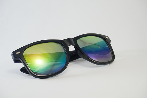Rainbow glasses with black frames on white background