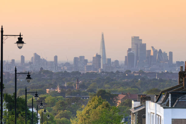 London Cityscape Skyline Stunning Image of the City of London Cityscape  taken at Dusk with wonderful Orange Glow on the buildings. hyde park london photos stock pictures, royalty-free photos & images
