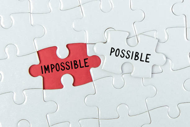 istock Pieces of jigsaw puzzle with word Possible and Impossible. 1332870796