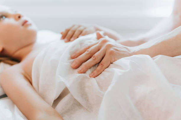 istock real doctor osteopath hands does physiological and emotional therapy for eight year old kid girl. pediatric osteopathy treatment session. alternative medicine. taking care of the child's health 1332874676