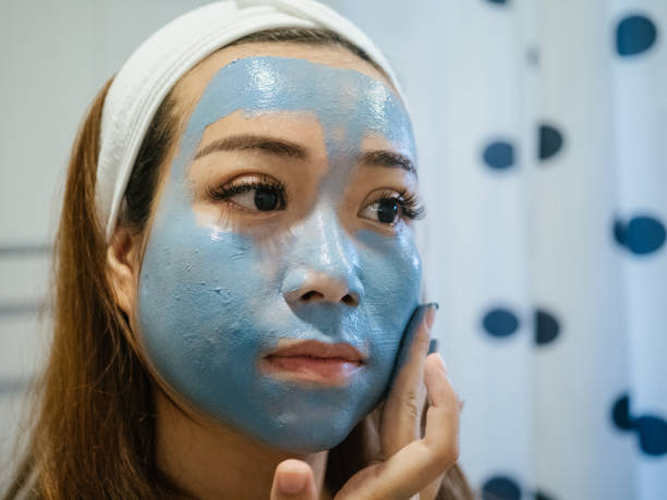 istock Woman doing face covered in moisturizing mask. 1332876377
