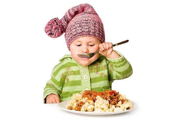istock Cute child eating from big plate; isolated over white 133288354