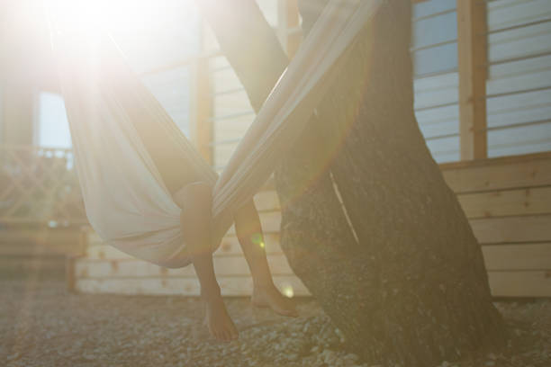 istock Childs legs looking out of a hammock 1332891637