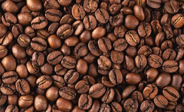 istock freshly roasted coffee beans background 1332892415