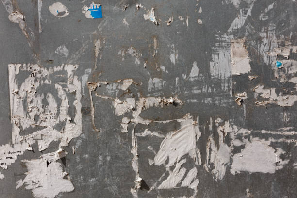 istock zinc-plated sheet fence with paper advertisements leftovers 1332896235