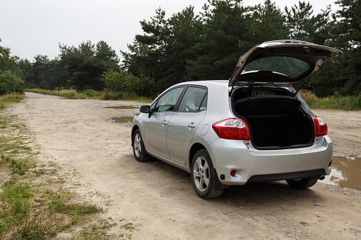 Dnipro, Ukraine - July 30, 2021: Toyota Auris 2012 silver color with open trunk