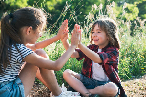A boy and a girl playing outside