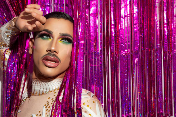 istock young man makeup drag queen performer with colorful background 1332900427