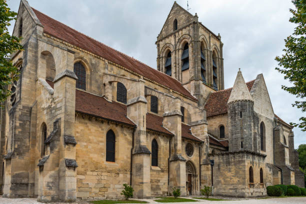 The Church of Notre Dame de Auvers-sur-Oise, site of a painting by Vincent Van Gogh Famous church painted by the great painter Vincent Van Gogh auvers sur oise photos stock pictures, royalty-free photos & images