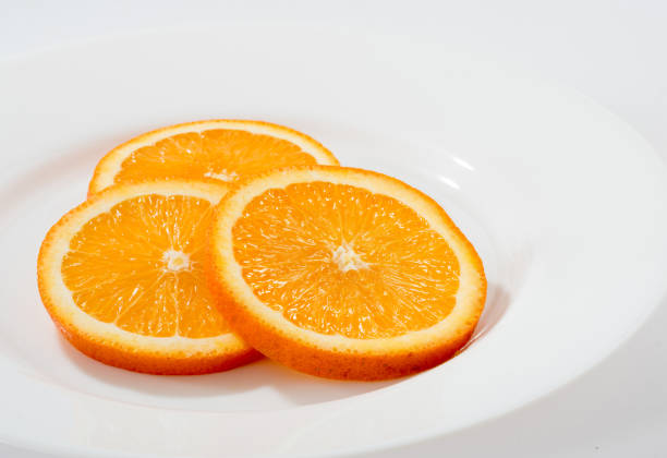 istock Orange slices isolated on white background 1332907405