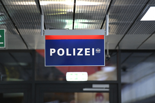 Sign of the police station at Linz Airport at night, Upper Austria, Austria, Europe