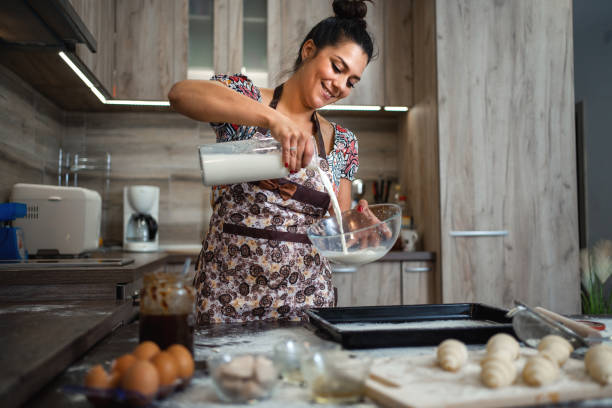 istock Woman kneading pastries at home in the kitchen 1332914292