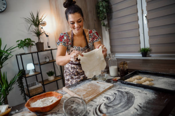 istock woman kneading pastries at home in the kitchen 1332914342