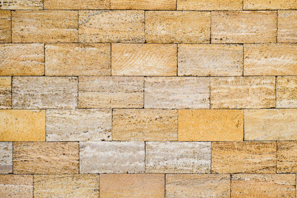Texture of a stone wall made of shell rock blocks. Brick wall from blocks of natural origin.