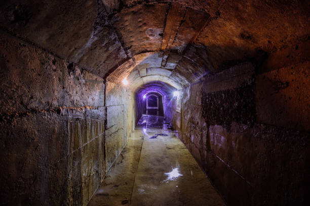 istock Old dark vaulted underground flooded sewer tunnel 1332914959