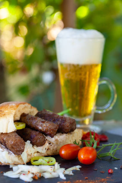 Cevapi - Balkan minced meat kebab served with beer stock photo
