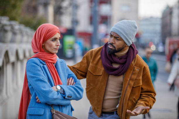 istock Young Multi-Ethnic Couple is Having a Relationship Problems During a Walking Through the City Streets. 1332924770
