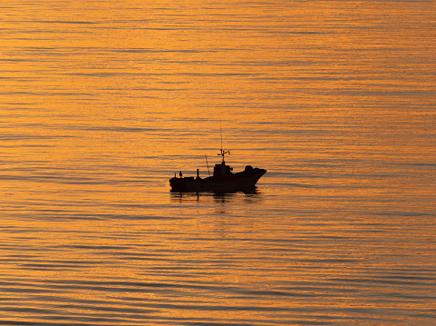 Hokkaido,Japan - June 22, 2021: A fishing boat near Rausu fishing port at sunrise, Shiretoko, Hokkaido, Japan