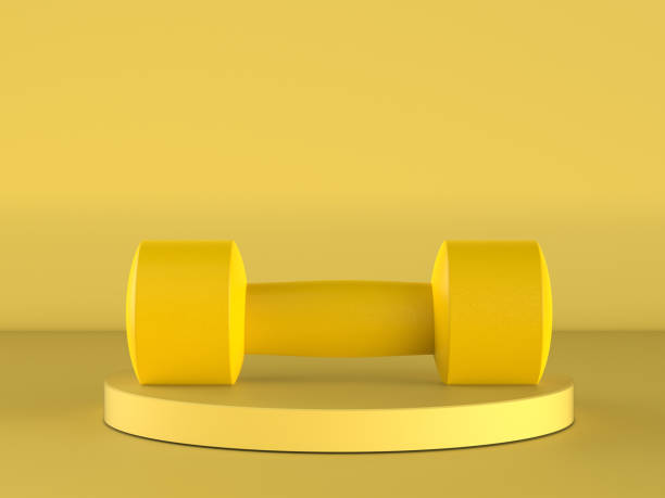 istock yellow dumbbell on yellow background 1332935454