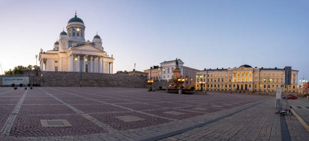A view from the senate square in downtown Helsinki. The Helsinki cathedral and government building during midnight. stock photo