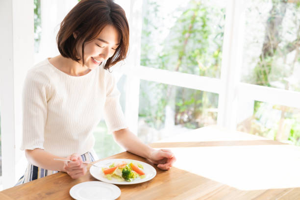 istock attractive asian woman who eats 1332939032